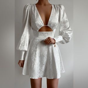 White mini dress with long sleeves